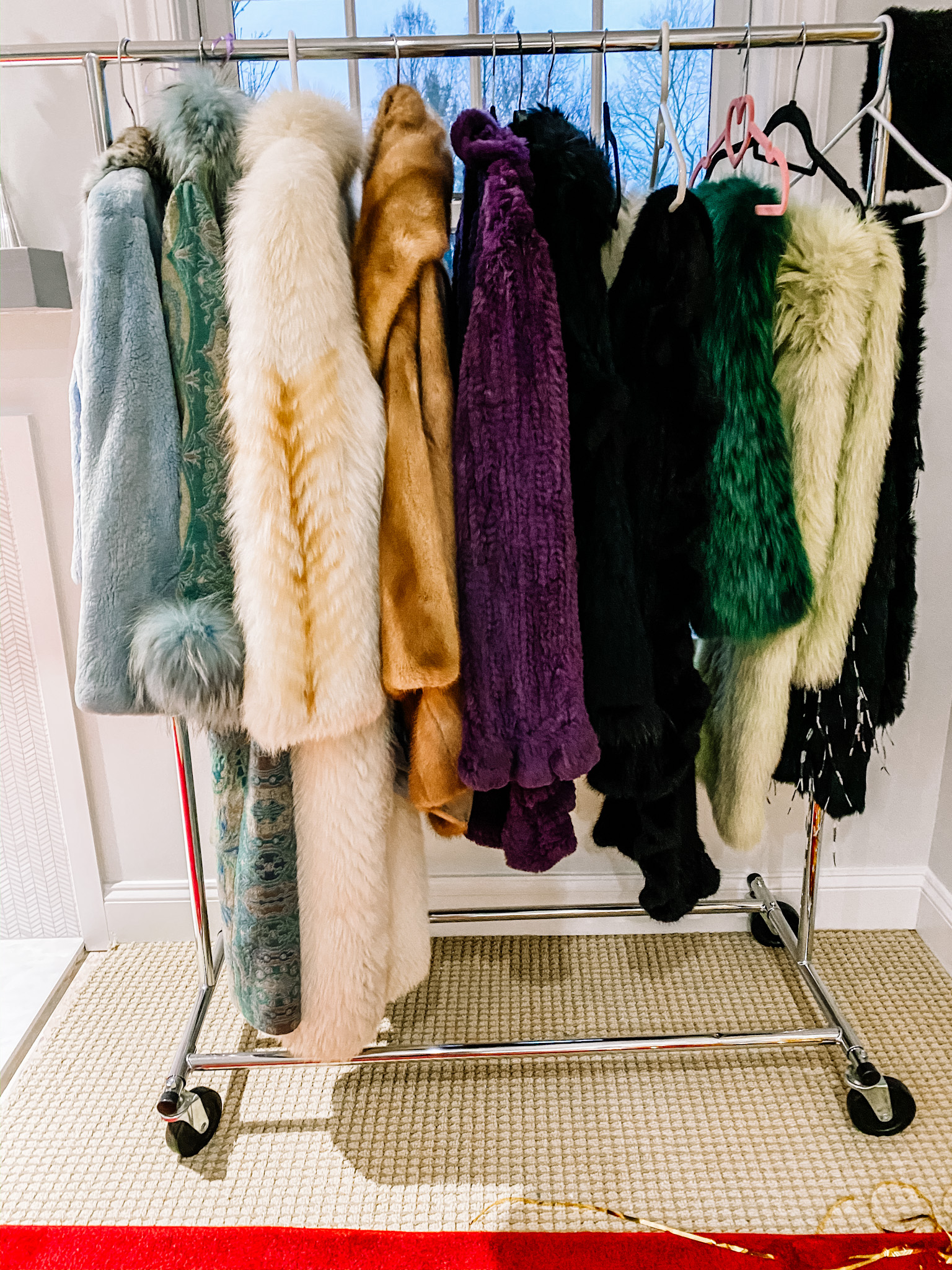 A rack of glamorous furs to try on for an Old Hollywood book club or Oscar party.